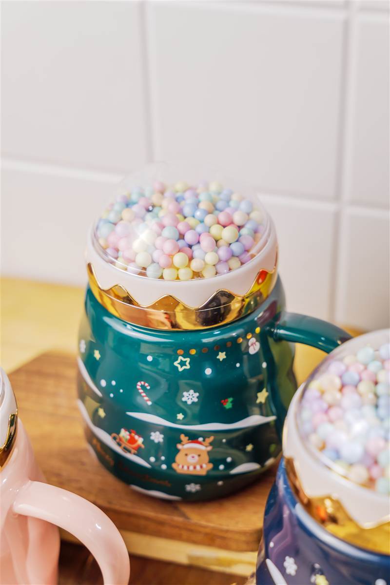 Teal Christmas mug with a dome lid on a wooden board, Emery
