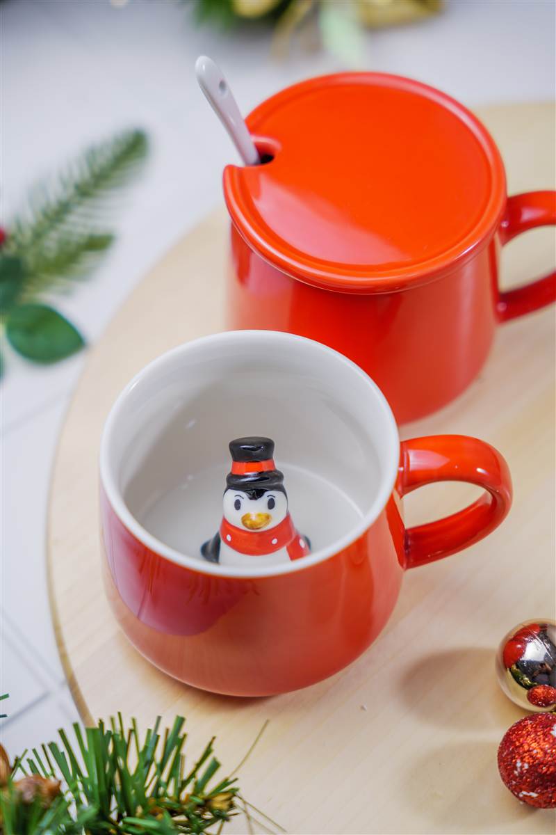 Red mug with a small figure inside, Emery Christmas