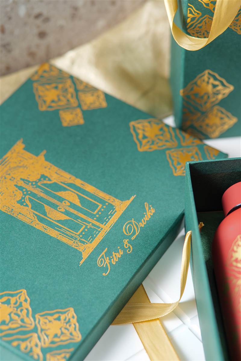 Teal gift box with gold foil and a red bottle inside, Red Ribbon wedding souvenir